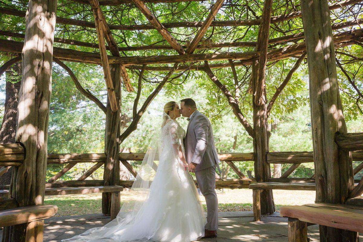 Kiss under the veil at Cop Cot - Central Park Wedding - New York City