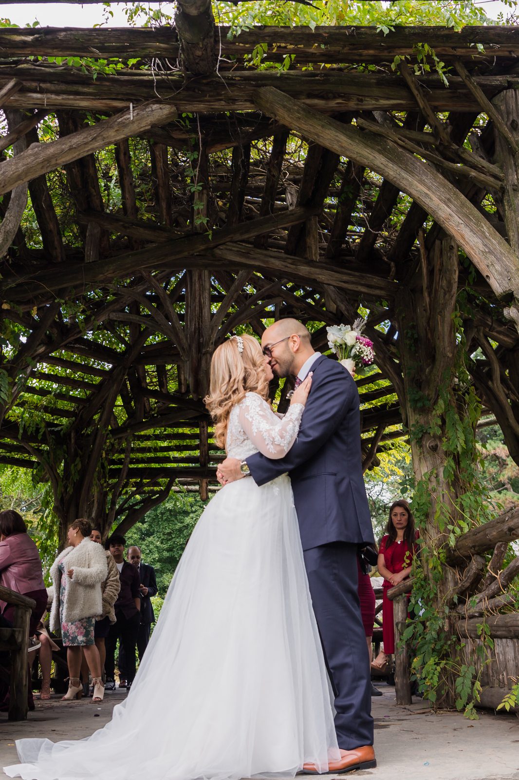 Kiss beneath the ivy-covered Dene Summerhouse in Central Park